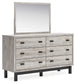 Vessalli King Panel Bed with Mirrored Dresser